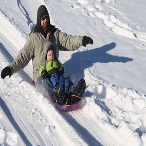 man and child sleigh burnout program