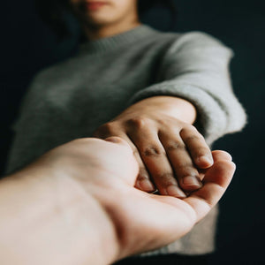 Picture of hand reaching out to another extended hand