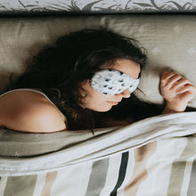 Load image into Gallery viewer, picture of woman in bed with eye mask on representing the effectiveness of our sleep treatment